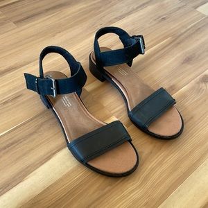 Tom’s black leather and suede sandal